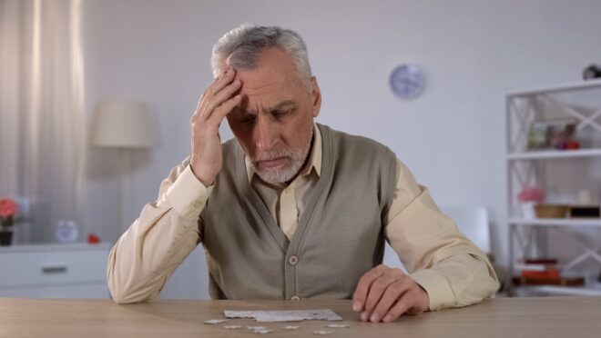 Pensioner,trying,to,combine,puzzle,,having,memory,problems,,cognitive,impairment