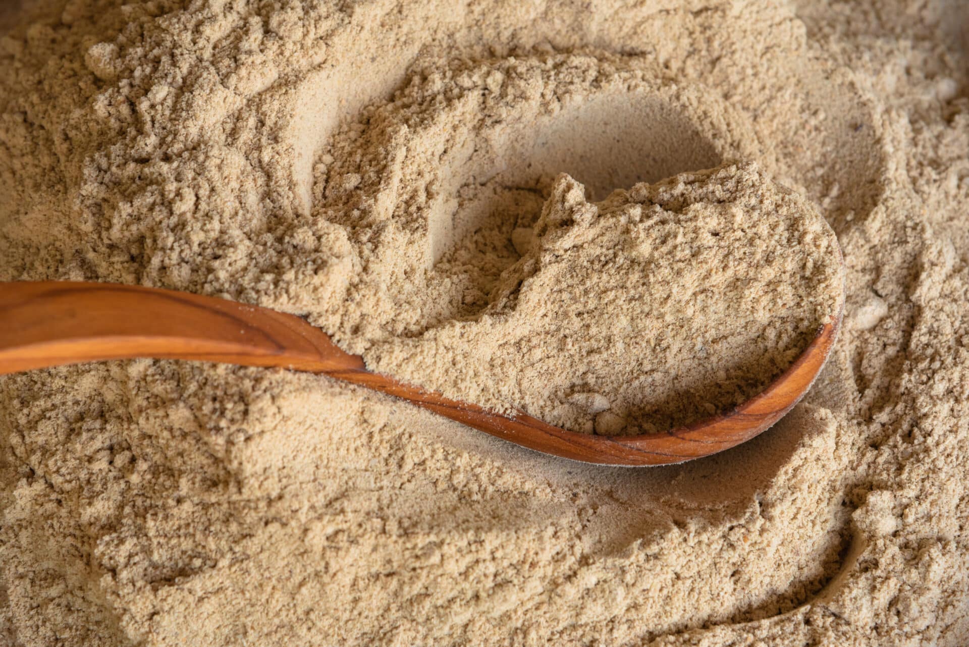 Rice bran and wooden spoon