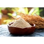 Rice bran and rice seeds on a natural background