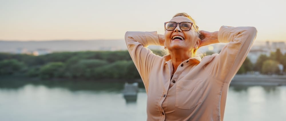 Woman with a healthy gut stretches happily