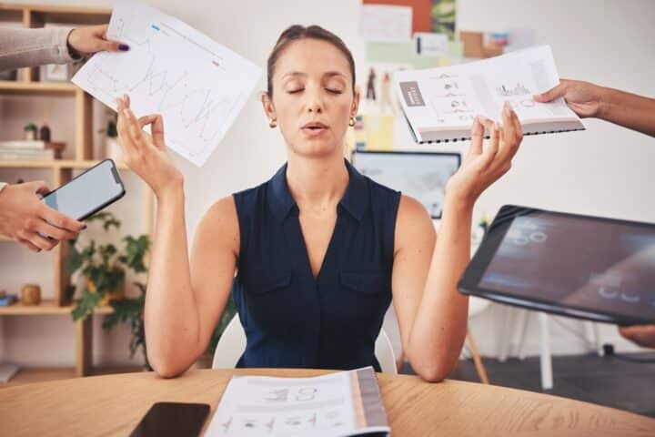 Woman sitting stressed at desk