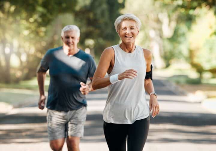 Middle aged man and woman jogging